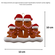 Family ornament with 4 brown gingerbread figures in red Christmas hats, graphed to show size (13x10cm).