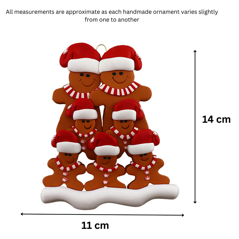 Family ornament with 7 brown gingerbread figures in red Christmas hats, graphed to show size (11x14cm).
