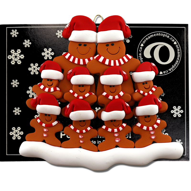 Family ornament with 10 brown gingerbread figures in red Christmas hats, on display backing card.