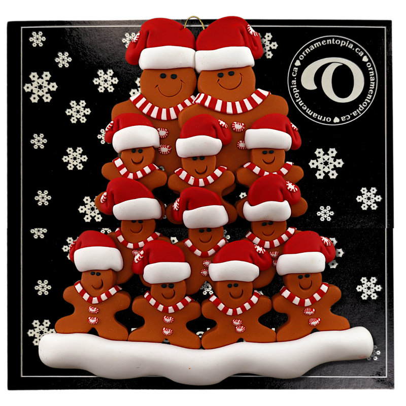 Family ornament with 12 brown gingerbread figures in red Christmas hats, on display backing card.