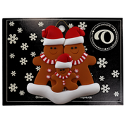 Family ornament with 3 brown gingerbread figures in red Christmas hats, on display backing card.