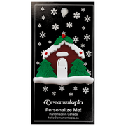 Brown festive house ornament, on display backing card.