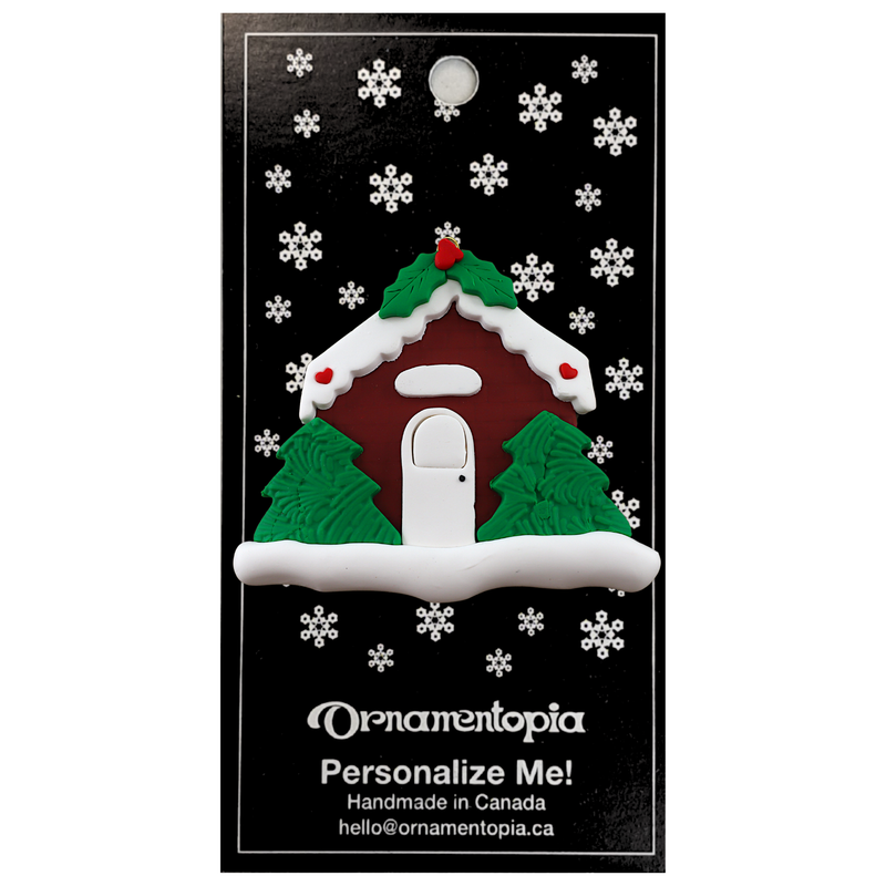 Brown festive house ornament, on display backing card.