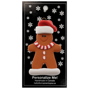 Gingerbread cookie ornament, on display backing card.