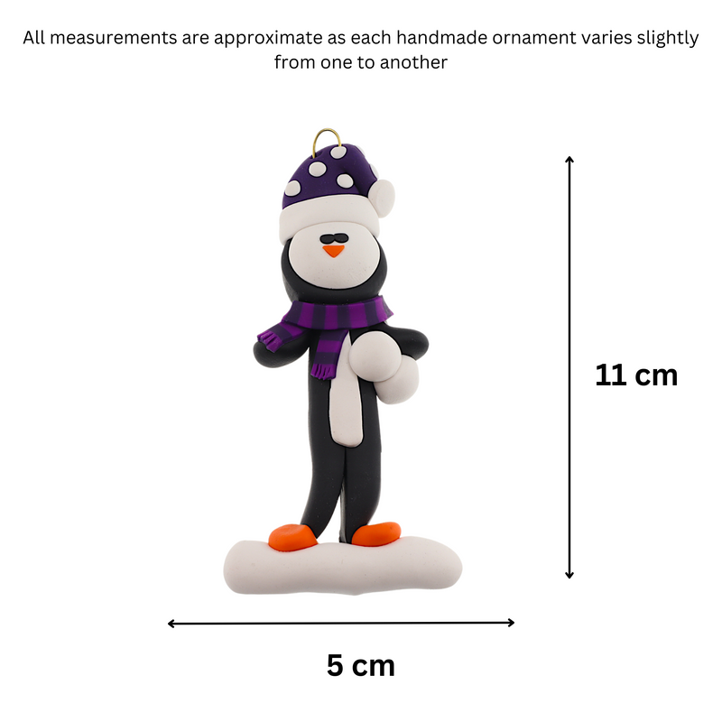 Penguin wearing purple hat and scarf ornament, graphed to show size (5x11cm).