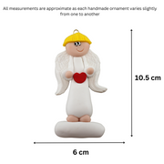 Tall angel wearing white with blonde hair ornament, graphed to show size (6x10.5cm).