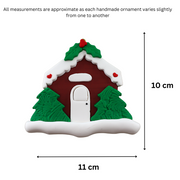 Brown festive house ornament, graphed to show size (11x10cm).