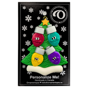 Christmas tree ornament decorated with 4 light bulbs with smiling faces, on display backing card.
