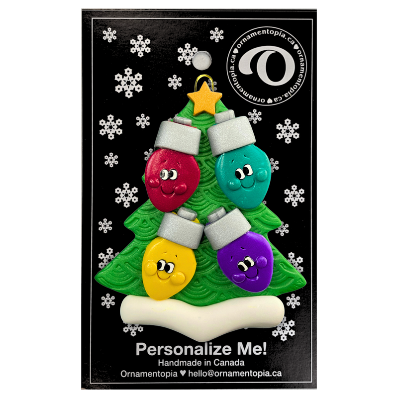 Christmas tree ornament decorated with 4 light bulbs with smiling faces, on display backing card.