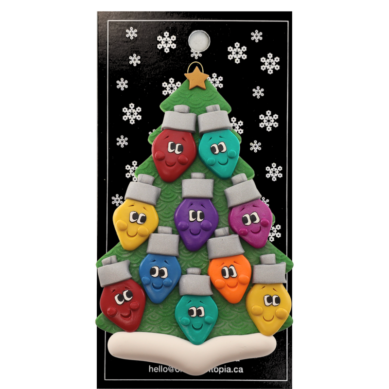 Christmas tree ornament decorated with 10 light bulbs with smiling faces, on display backing card.