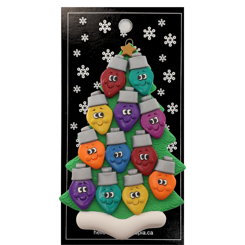 Christmas tree ornament decorated with 12 light bulbs with smiling faces, on display backing card.
