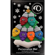 Christmas tree ornament decorated with 6 light bulbs with smiling faces, on display backing card.