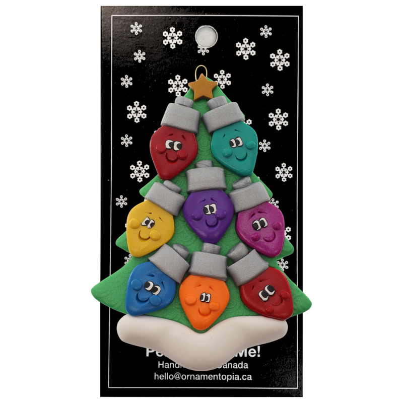 Christmas tree ornament decorated with 8 light bulbs with smiling faces, on display backing card.