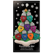 Christmas tree ornament decorated with 9 light bulbs with smiling faces, on display backing card.