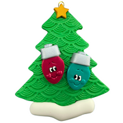 Christmas tree ornament decorated with 2 light bulbs with smiling faces.