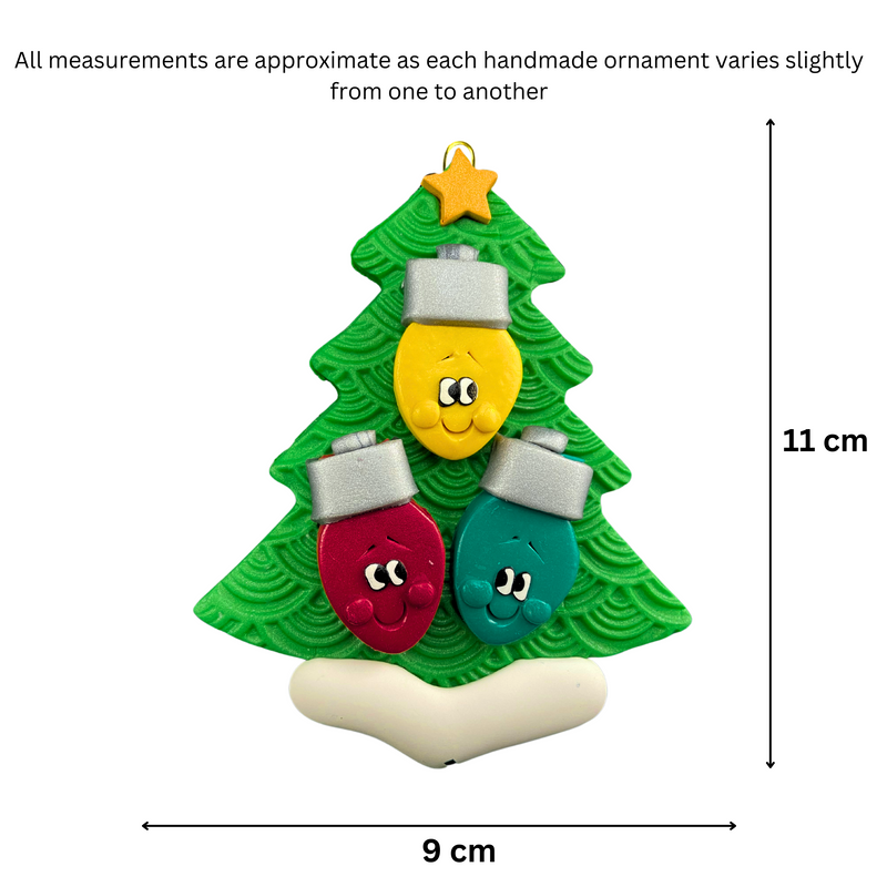 Christmas tree ornament decorated with 3 light bulbs with smiling faces, graphed to show size (9x11cm).