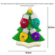 Christmas tree ornament decorated with 4 light bulbs with smiling faces, graphed to show size (9.5x11.5cm).