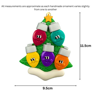 Christmas tree ornament decorated with 5 light bulbs with smiling faces, graphed to show size (9.5x11.5cm).