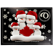 Family ornament with 4 white snowmen in red hats, gathered around a red maple leaf, on display backing card.