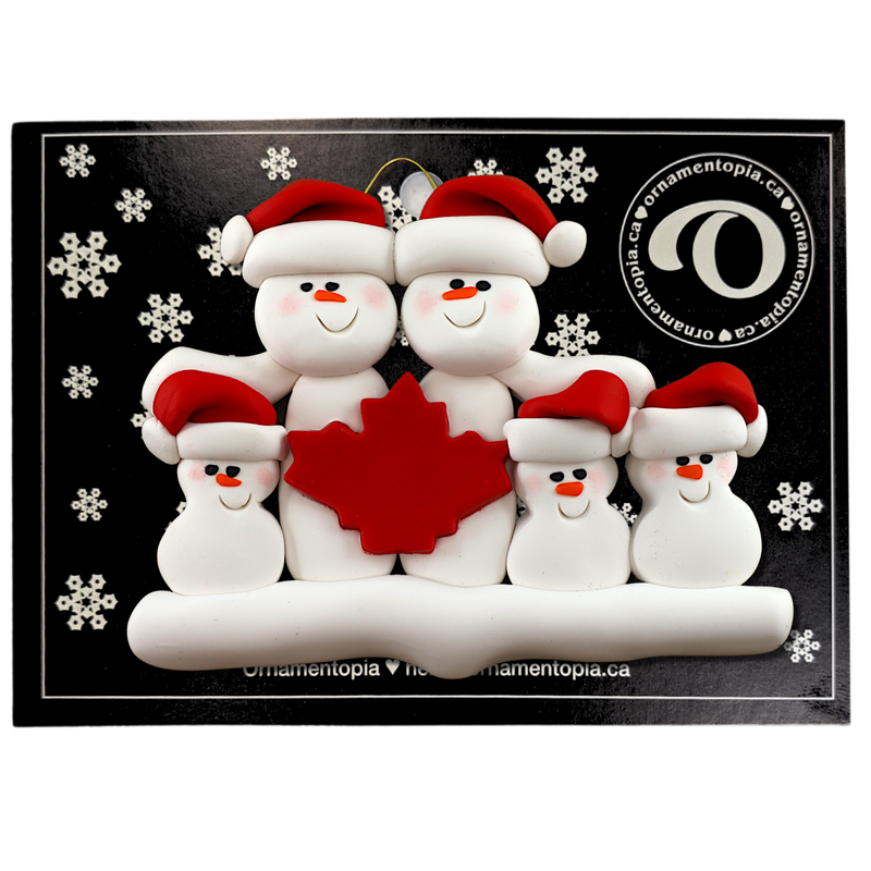 Family ornament with 5 white snowmen in red hats, gathered around a red maple leaf, on display backing card.
