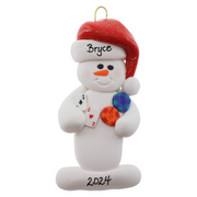 Ornament of white snowman in red hat holding cards and poker chips, personalized with name.
