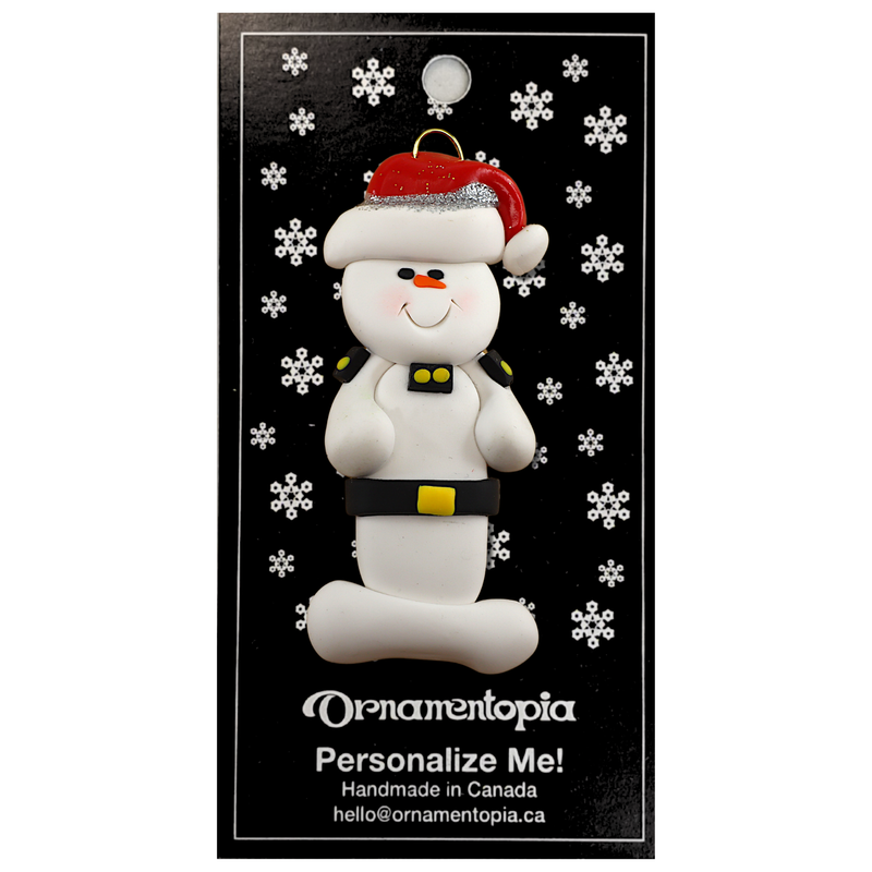 Ornament of white snowman in red hat wearing a striped police outfit, on display backing card.