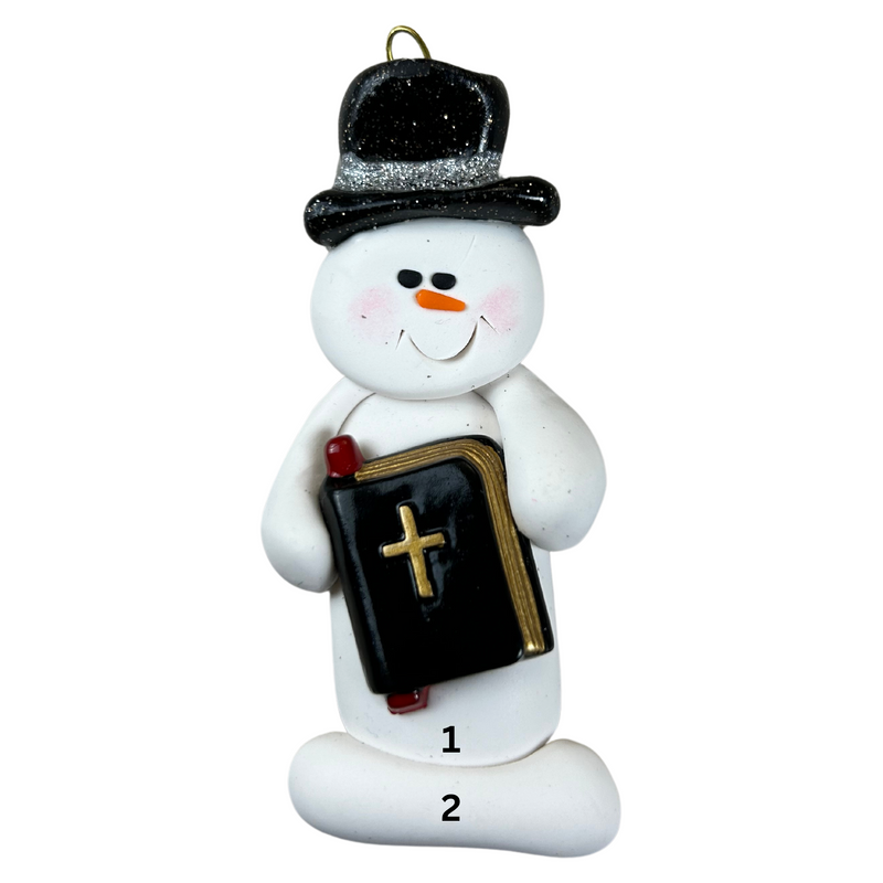 Ornament of white snowman in black top hat, holding a Bible, numbered 1-2 for personalization.