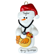 Ornament of white snowman in red hat holding chicken and stethoscope, personalized with name.