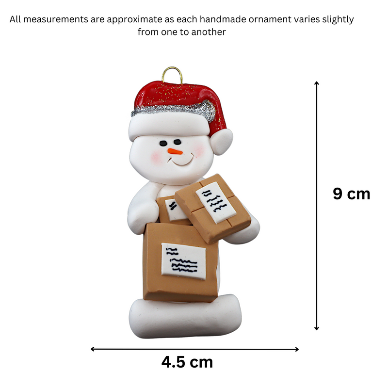 Ornament of white snowman in red hat holding several parcels, graphed to show size (4.5x9cm).