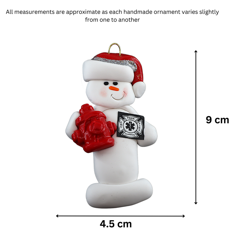 Ornament of white snowman in red hat holding a fire hydrant and firefighter badge, graphed to show size (4.5x9cm).