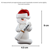 Ornament of white snowman in red hat holding a white diploma, graphed to show size (4.5x9cm).