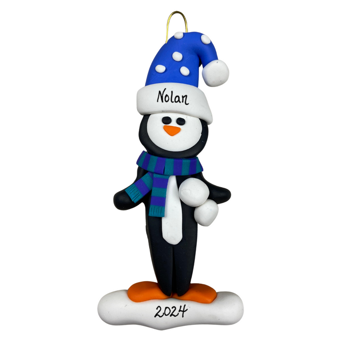 Penguin wearing blue hat and scarf ornament, personalized with name.