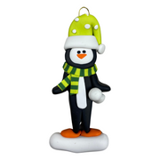 Penguin wearing green hat and scarf ornament.