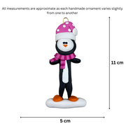 Penguin wearing pink hat and scarf ornament, graphed to show size (5x11cm).