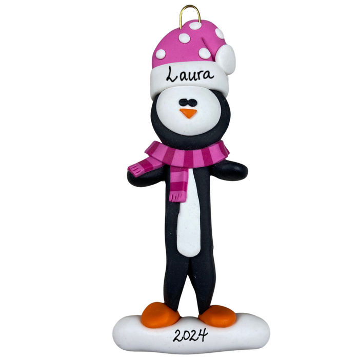 Penguin wearing pink hat and scarf ornament, personalized with name.