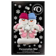 Family ornament with 2 large and 2 infant snowmen in pink, on display backing card.