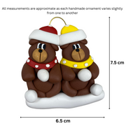 A couple’s ornament of two brown bears in polka dot scarves and hats, graphed to show size (6.5x7.5cm).
