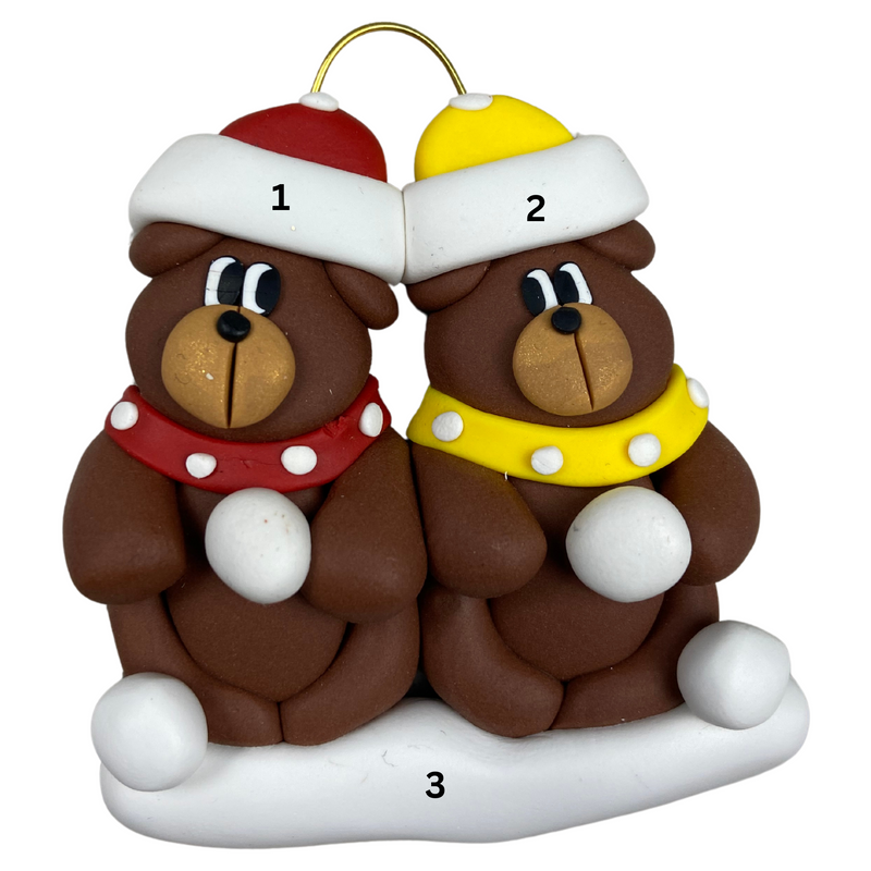 A couple’s ornament of two brown bears in polka dot scarves and hats, numbered 1-3 for personalization.