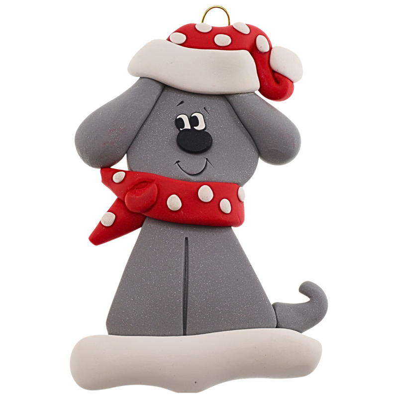 Ornament of grey dog in a red and white polka dot Christmas hat and scarf.