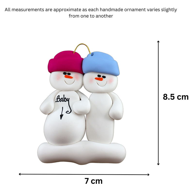 Family ornament with 2 snowmen in bright hats, one pregnant, graphed to show size (7x8.5cm).