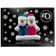 Family ornament with 2 white snowmen in colourful hats holding matching presents, on display backing card.