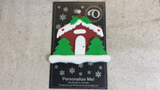 Brown festive house ornament, shown on backing card and Christmas tree.