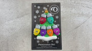 Christmas tree ornament decorated with 6 light bulbs with smiling faces, shown on backing card and decorated Christmas tree.