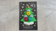 Christmas tree ornament decorated with 3 light bulbs with smiling faces, shown on backing card and decorated Christmas tree.