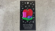 Red apple with pink book and purple worm teacher appreciation ornament, shown on backing card and Christmas tree.