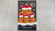Family ornament with 5 brown gingerbread figures in red Christmas hats, shown on backing card and Christmas tree.