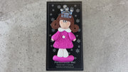Pink princess with crown and brown hair ornament, shown on backing card and Christmas tree.