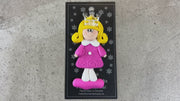 Pink princess with crown and blonde hair ornament, shown on backing card and Christmas tree.