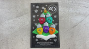 Christmas tree ornament decorated with 5 light bulbs with smiling faces, shown on backing card and decorated Christmas tree.