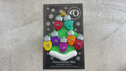 Christmas tree ornament decorated with 7 light bulbs with smiling faces, shown on  backing card and decorated Christmas tree.